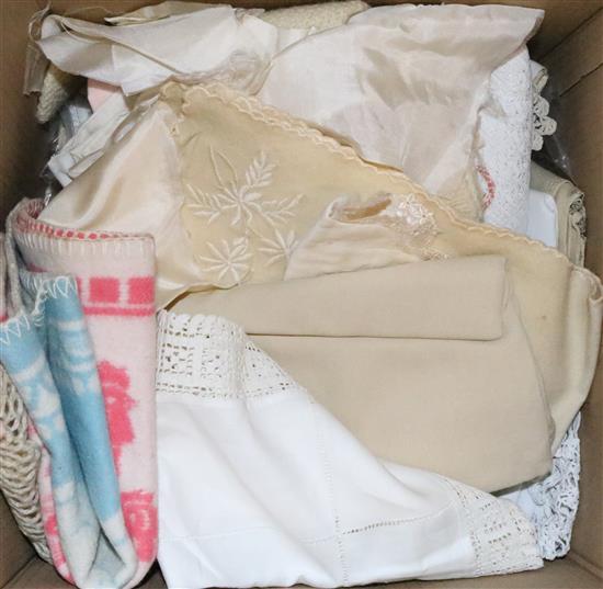Box of table linen and bag of antique dolls clothes